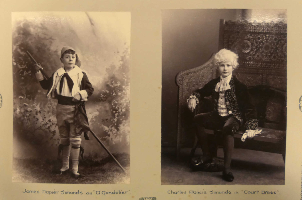 Two boys in fancy dress. Left has words 'James Napier Simonds as a Gondolier'; right has words 'Charles Francis Simonds in Court Dress' ref. D/EX1792/1