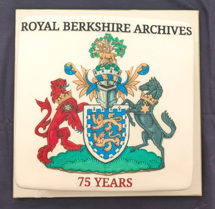 Square cake with the words Royal Berkshire Archives at the top the Berkshire County Arms center and and 75 years bottom